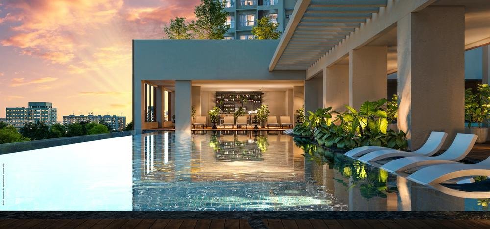 Infinity swimming pool with sunset lounge at Godrej Elaris